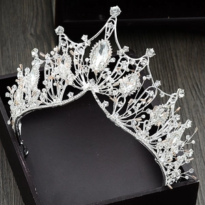 Detailed close-up of Baroque silver crown featuring sparkling crystals and rhinestones