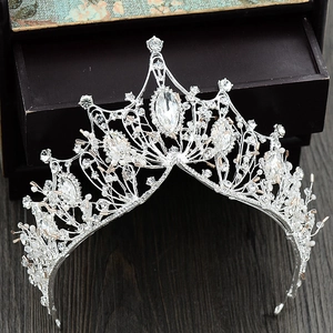 Detailed view of silver Baroque crown with sparkling crystals and rhinestones for brides