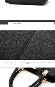 Detail of black lychee grain PU leather handbag with golden metal hardware