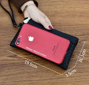 Black quilted clutch bag measuring 19.5cm length with a 5.5-inch phone size comparison