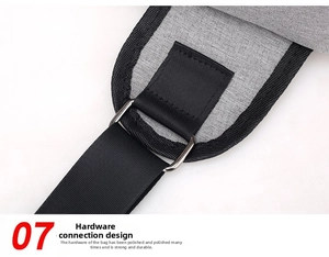 Detail of metal ring buckle and reinforced stitching on gray canvas shoulder bag