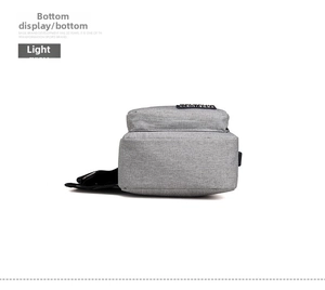 Detailed bottom view showing the woven nylon texture and silver buckles of the light grey sling bag
