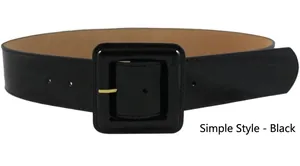 Detail of a wide black faux leather waist belt with a large square buckle and gold pin