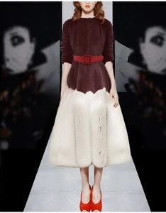 Red leather waist belt with square buckle styled over a luxury burgundy fur coat