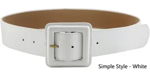 Detail of white wide leather waist belt featuring a matching fabric square buckle and gold pin