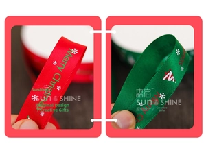 Close-up of red and green Merry Christmas satin ribbons with white festive prints