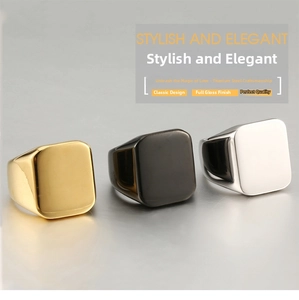 Macro display of polished titanium steel signet rings in gold, black, and silver finishes