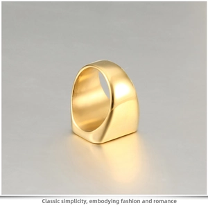 Macro detail of high-polish wide gold titanium steel ring with minimalist smooth finish