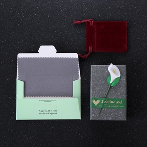 Exquisite gift packaging set with velvet drawstring pouch, cleaning cloth, and floral gift box