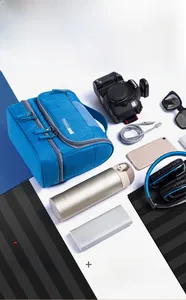 Detailed top view of blue multi-layer digital organizer bag for electronic accessories