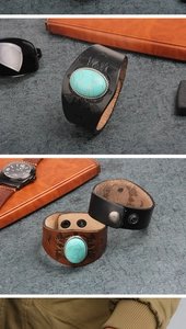 Close-up of leather bracelets with turquoise stones and embossed patterns with snaps