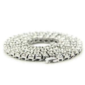 Macro shot of 5mm silver hip-hop necklace featuring a single row of sparkling crystals