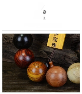 Macro shot of colorful polished wood beads bracelet with an engraved rectangular tag