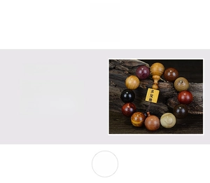 Macro detail of multi-wood prayer beads showing rich textures and square tag