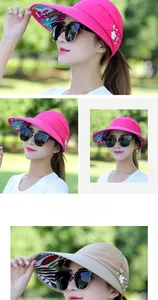 Detail of sun visor hat with floral brim pattern and elegant pearl flower ornaments