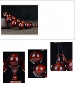 Macro detail of natural sandalwood beads with fine wood grain and bottle pendant