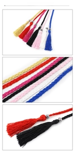 Detail of colorful woven tassels with silver hollow floral beads in a vertical layout