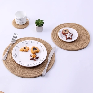 Macro detail of round woven jute placemats in multiple sizes with rustic texture
