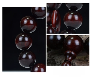 Detailed view of polished red sandalwood beads with natural wood grain texture