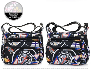 Nylon crossbody bag detail showing multiple zip pockets and geometric print patterns