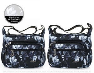 Detail of lightweight nylon shoulder bags featuring black and white floral prints and pockets