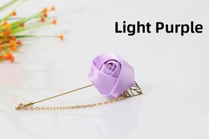 Detail view of light purple satin rose brooch with gold leaf, long pin and chain