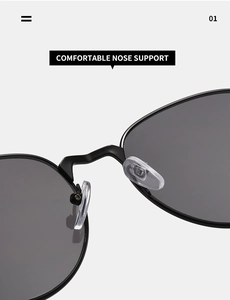 Close-up of comfortable silicone nose pads on retro oval metal sunglasses frame
