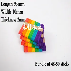 Macro detail of colorful wooden craft sticks bundle sized 93x10x2mm for DIY art projects