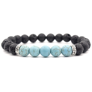 Detail of 8mm black lava stone bracelet with blue mineral beads and silver spacers