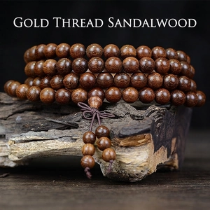Golden Sandalwood 108 prayer beads bracelet with smooth wood grain and silk texture