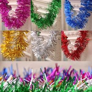 Close-up of 180cm colorful tinsel garlands wrapped around columns for festive decoration