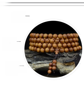 Macro detail of high-density natural sandalwood beads with polished oily texture
