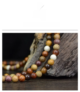 Macro shot of colorful wooden prayer beads with clear textures and natural matte finish