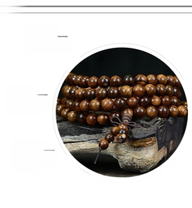 Macro detail of high-density natural wood beads with rich oil texture and grain