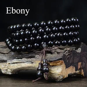Handcrafted ebony wood mala bracelet with 108 prayer beads and carved gourd pendant