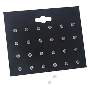 Detail of 48 bulk silicone earring backings with metal core on display card
