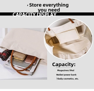 Detail showing high capacity canvas tote bag interior and side pocket storage for essentials