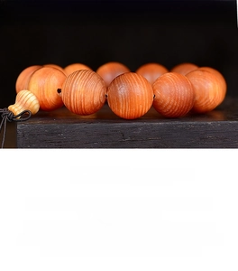 Detailed view of Blood Dragon Wood prayer beads showing natural wood grain and texture