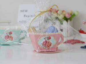 Macro detail of vintage European-style teacup paper favor box with pink rose floral patterns