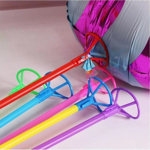 Colorful plastic balloon sticks and cups supporting a large foil balloon in close-up detail