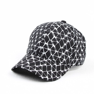 Detailed close-up of a baseball cap featuring a black and white geometric grid pattern