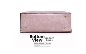 Detail view of pink PU leather tote bag base with four protective gold metal feet studs