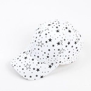 Detailed close-up of white baseball cap with black star patterns and curved brim