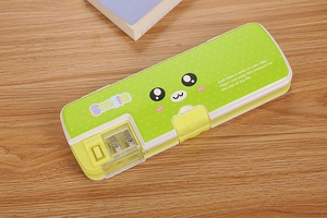 Top view of green double-opening pencil case with built-in sharpener on desk