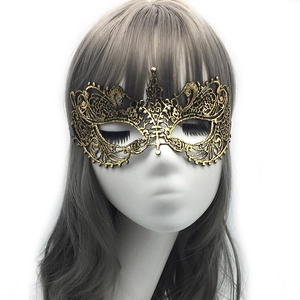 Elegant gold hollow lace masquerade mask with intricate patterns on model head