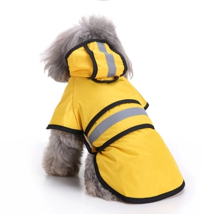 Detail view of yellow hooded pet raincoat with reflective safety strip on dog back