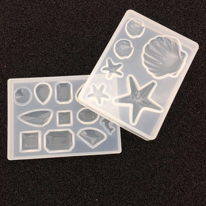 Detailweergave van DIY siliconen mallen voor zeeschelp en geometrische sieraden vormen