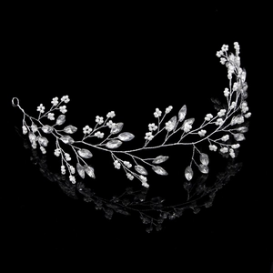 Handmade bridal hairband with silver vine, pearls and marquise rhinestones on black background