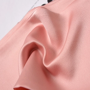 Elegant pink satin skinny scarf for women with a smooth silk texture and soft drape