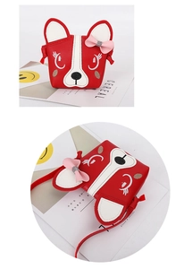 Detail view of a red puppy cartoon crossbody bag with pink bow and PU leather texture